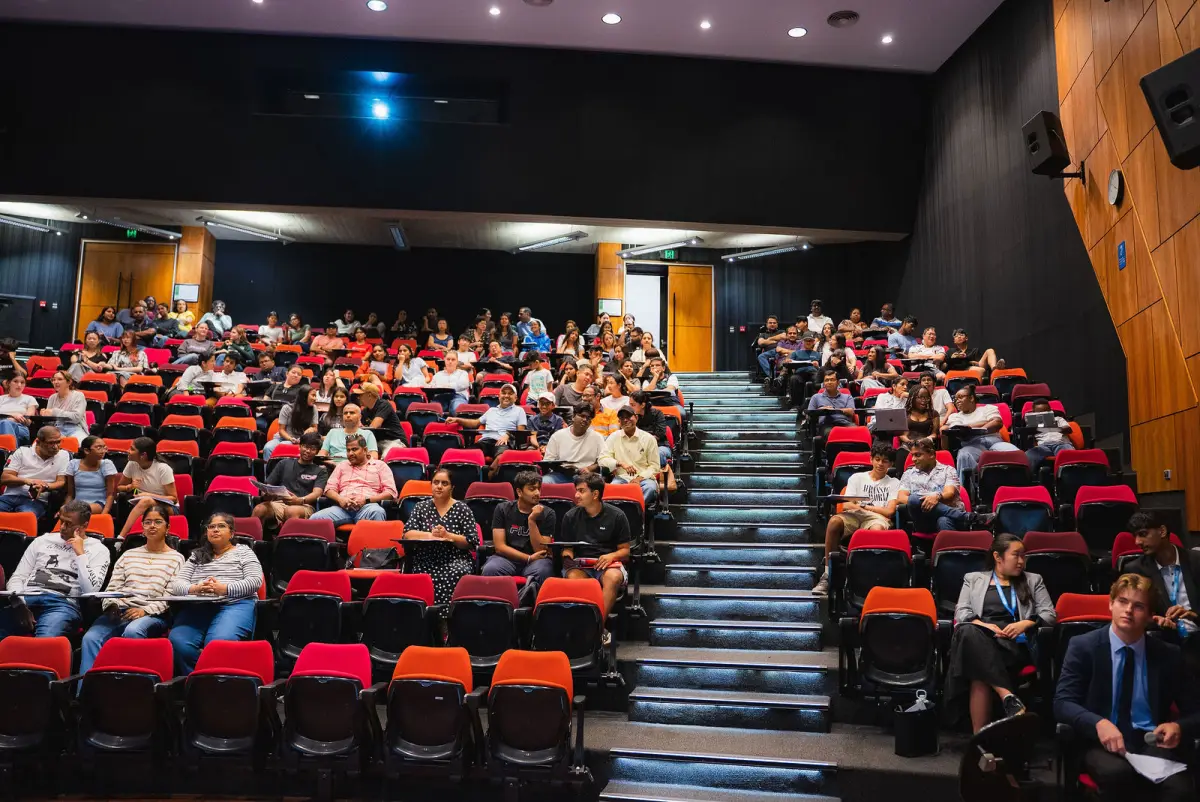 Students and parents in the lecture theatre, seen from the stage