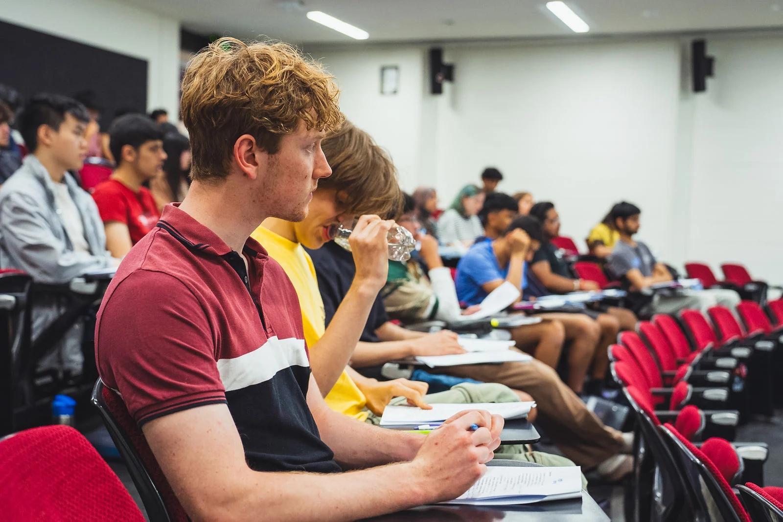 Students writing notes at an Everest interview course