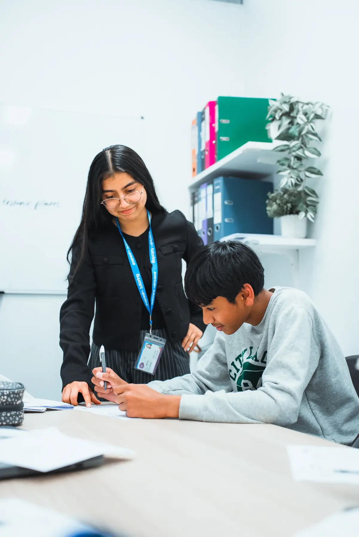 An Everest tutor working one on one with a student on a past paper